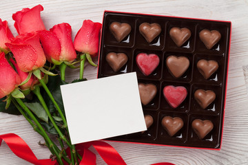 Valentines day with red roses and chocolate