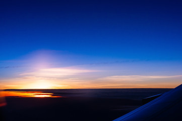 Fototapeta na wymiar Beautiful twilight sky looking from airplane,