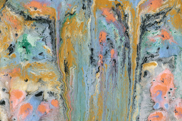 Obraz na płótnie Canvas Colorful wet abstract paint leaks and splashes texture on white watercolor paper background. Natural organic shapes and design.