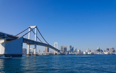 Rainbow Bridge and cityscape in Tokyo, Japan