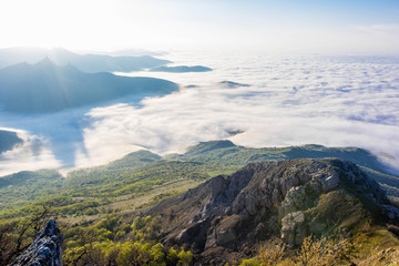 Beautiful sunset in the Crimean mountains, Crimea. Majestic sunset in the mountains landscape with sunny beams.