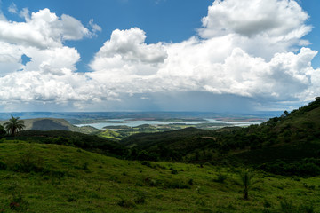 Fototapeta na wymiar Landscape of mountains with dammed lake in the region of Minas Gerais, Brazil