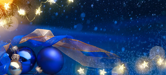 Art Christmas tree  light and holidays decoration on blue snow background