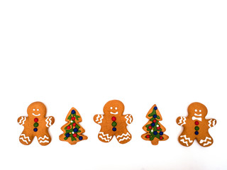 Happy New Year and Merry Christmas gingerbread on white background. Christmas baking. Making gingerbread christmas cookies. Christmas concept.