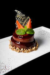 Elegant chocolate cake decorated with mint