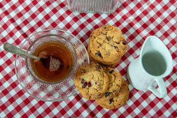cup of tea with delicious  cookies