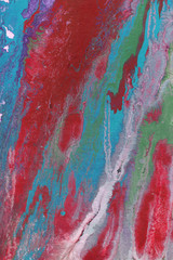 Colorful wet abstract paint leaks and splashes texture on white watercolor paper background. Natural organic shapes and design.