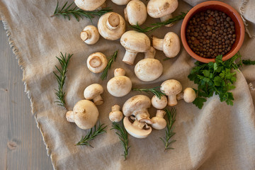 Champignon mushrooms on a gray cloth
