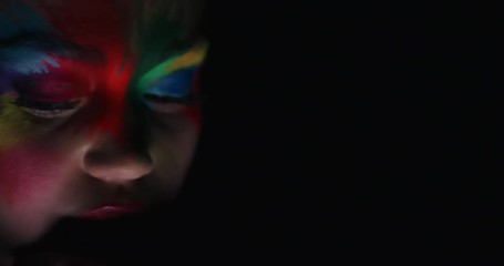 close up portrait beautiful woman wearing colorful face paint dancing exotic multicolored body art with light flashing in dark fantasy
