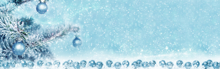 Blue balls at the fir tree, christmas background, banner