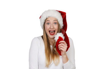 Junge Frau mit Weihnachtsmütze lacht begeistert