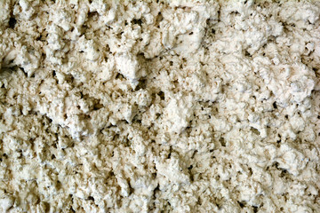 old cemen wall  topping with rough plaster