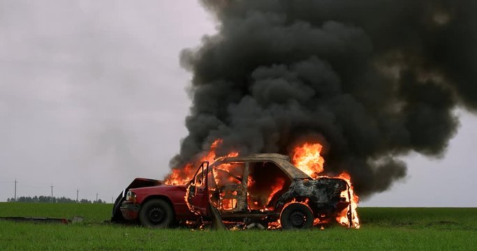 Car On Fire, Burning Car Sedan On The Field, Side View