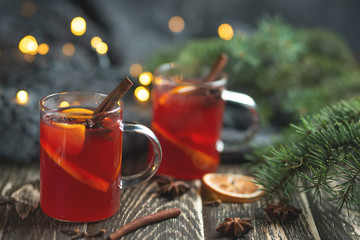 Mulled wine in transparent circles with spices and citrus fruits