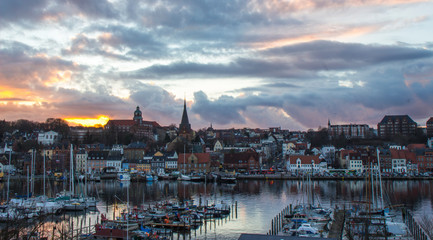 Dramatic sky during sunset in small coastal town in Germany, Flensburg