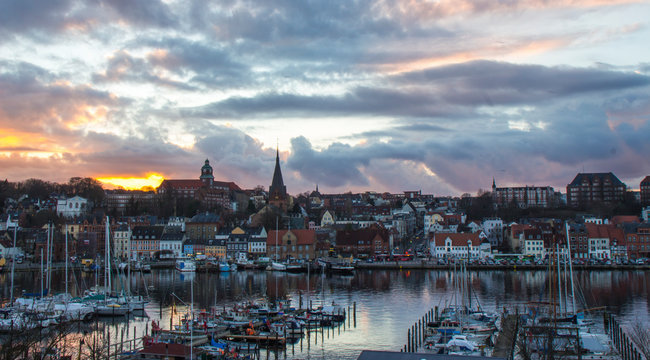Dramatic sky during sunset in small coastal town in Germany, Flensburg