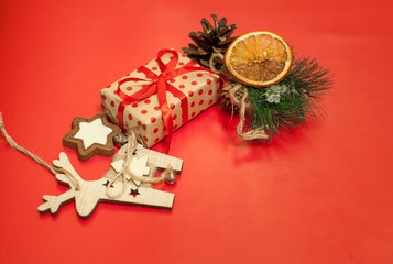 Christmas gifts on a red background with a red ribbon, Christmas toys