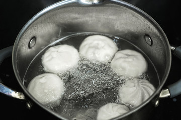 delicious dumplings are cooked in a saucepan