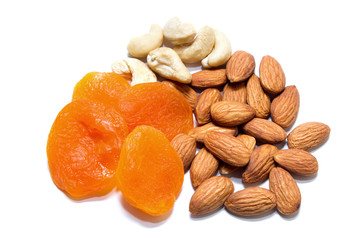Dried apricots, almonds and cashews, isolated on a white background. View from above
