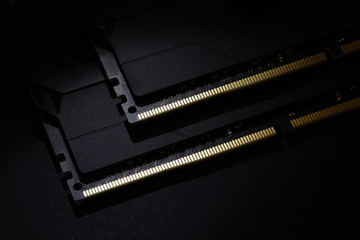 Close-up of Computer RAM (Random Access Memory) module on black background.