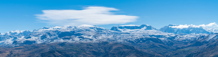 Panoramic view of a valley with snow capped mountains near Erzincan, Turkey