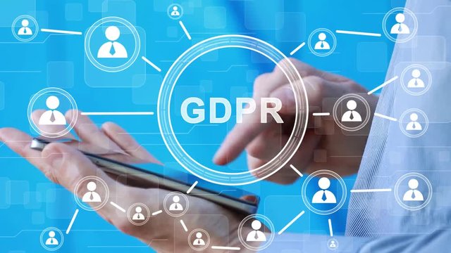 Businessman presses button GDPR general data protection regulation on phone and virtual web electronic user interface.