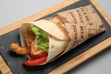 A shot of a tortilla sandwich, closeup