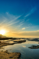 The sea and the beautiful expanse of blue sky with clouds and sunlight at sunset. Russia Azov sea.