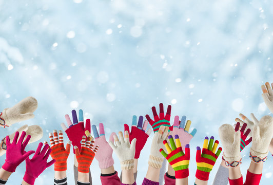 children hands with winter gloves and mittens background