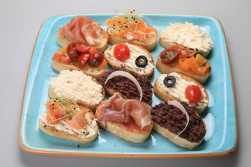 A set of many different small sandwiches