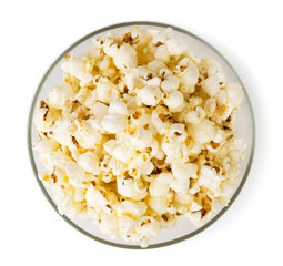 Popcorn in a glass plate top view.