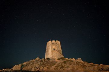 old hisoric sardinian tower at night. Lots of stars in the background