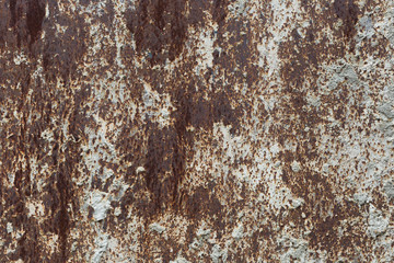 Old paint on a rusty metal surface. Grunge texture.  For background and design.