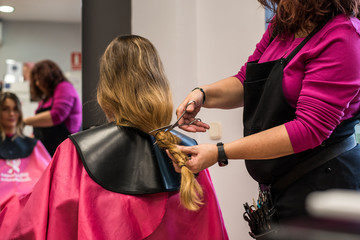 Woman donating hair for cancer