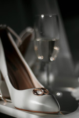 wedding rings, bridal shoes, champagne