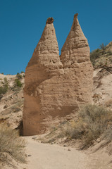 Twin hoodoos tower above the trail 