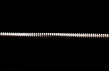Extreme macro shot of a guitar string isolated on black (shallow DOF, selective focus) - Powered by Adobe