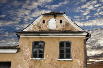 Giant crack on the facade of an old medieval  saxon house in Szaszkezd, Transylvania, Romania