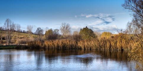 Cold spring day near a beautiful fishing lake in Sarisap, Hungary.
