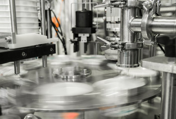 production and bottling of yogurt in plastic cups. equipment at the dairy plant