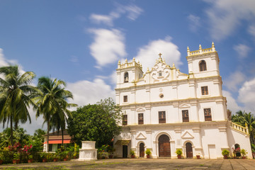 Fototapeta na wymiar Ancient St. Thomas church landscape in Aldona Goa surrounded by monsoon clouds 