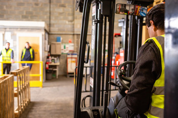 Practical forklift training course. Industrial background.
