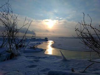 Sunrise on frosen Dnipro river, Ukraine