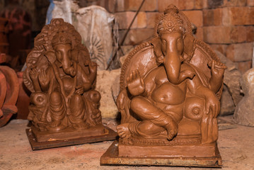 Unfinished Clay model of Lord Ganesh\Ganesha being prepared by local artisans in India before the Hindu festival Ganesh Chaturthi 