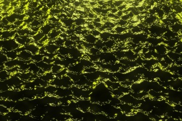 cute yellow festival shiny night water with city lights - abstract background of electric lights reflected in black liquid