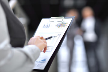 close up. business woman checking financial data