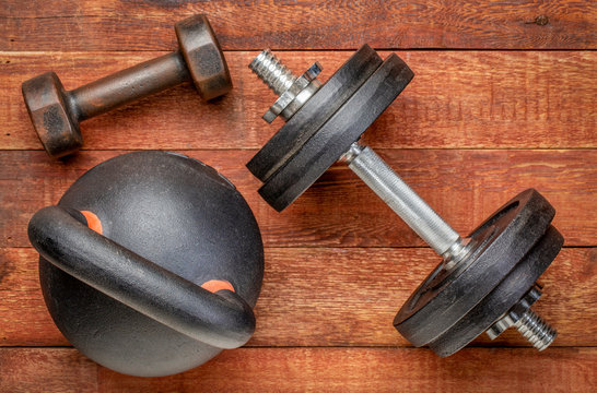 heavy iron kettlebell and dumbbells - fitness concept