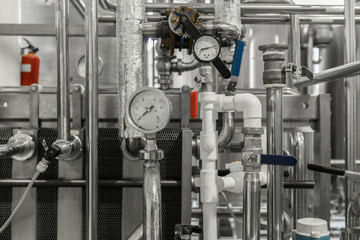 measurement sensors and pipes in the factory. equipment at the dairy plant