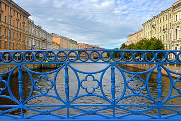 Blue Bridge across river Moika in Saint Petersburg, Russia. First cast iron bridge was built in...