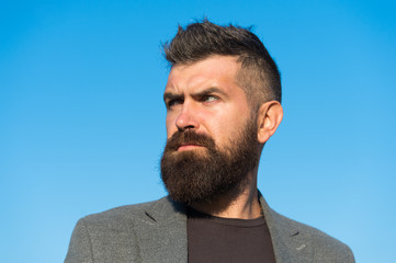 Hipster appearance. Beard fashion and barber concept. Man bearded hipster stylish fashionable coat....